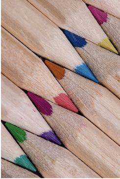 Colorful pencils arranged in pattern