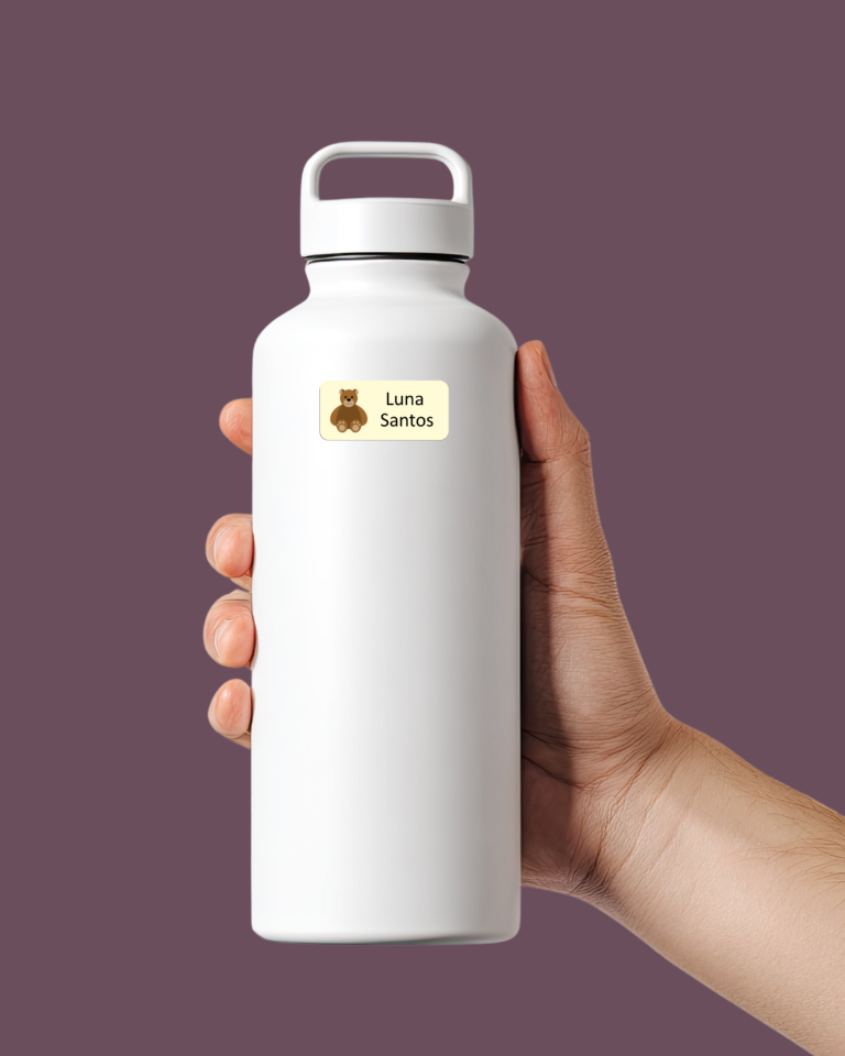 Child holding a stainless steel water bottle with waterproof name labels for kids, dishwasher safe and durable for school use